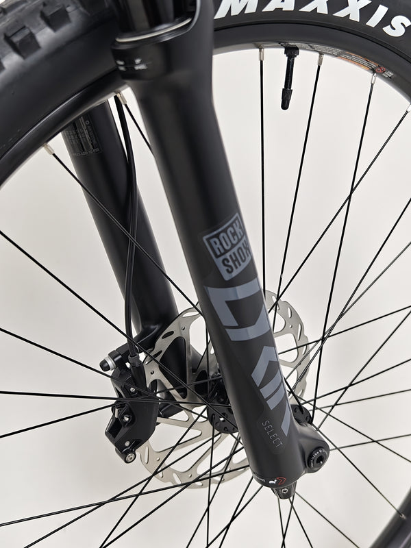 Nukeproof Mega 290 CARBON - Image of the bike with a rider preparing for a test ride.