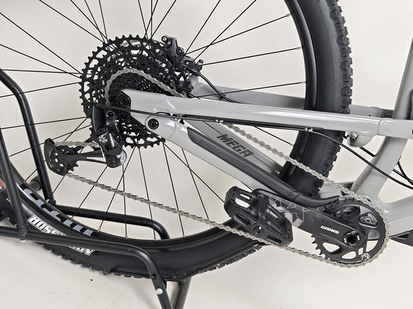 Nukeproof Mega 290 CARBON - Close-up of the SRAM NX Eagle 12-speed shifter on the handlebar.