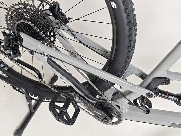 Nukeproof Mega 290 CARBON - Rear view focusing on bike's support and traction.