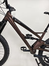Close-up of the handlebars and dropper seat post on the Orange ALPINE 6 mountain bike.