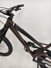 Orange ALPINE 6 Full Suspension Mountain Bike on display, showcasing craftsmanship and quality.