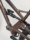 The Orange ALPINE 6 mountain bike presented in a urban setting, showcasing its vibrant color.