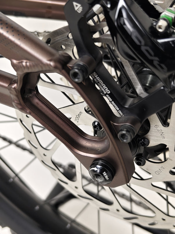 The Orange ALPINE 6 mountain bike showcasing its impressive features in a cycling event.