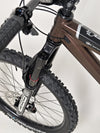Energetic shot of the Orange ALPINE 6 mountain bike navigating through snow.