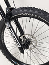 Side view of the Orange ALPINE 6 mountain bike highlighting its innovative design.