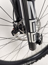 The Orange ALPINE 6 mountain bike showcased with the professional tools used for setup.