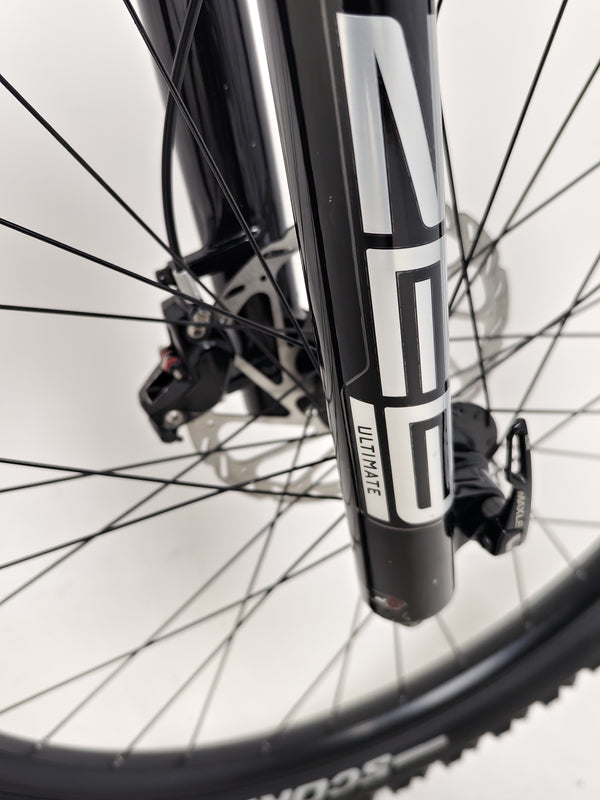 The Orange ALPINE 6 mountain bike showcased with the professional tools used for setup.