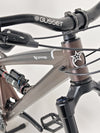 The Orange ALPINE 6 mountain bike's sleek design viewed from the rear end.