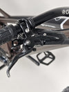 Rear view of the Orange ALPINE 6 Full Suspension Mountain Bike, emphasizing the sturdy components.