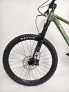 Norco Sight A2 2021 bike standing next to a mountain, emphasizing its mountain biking capabilities.
