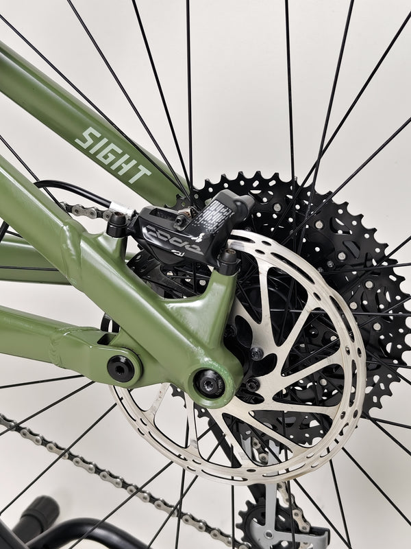 Norco Sight A2 2021 in focus against a blurred background, capturing the bike's details.