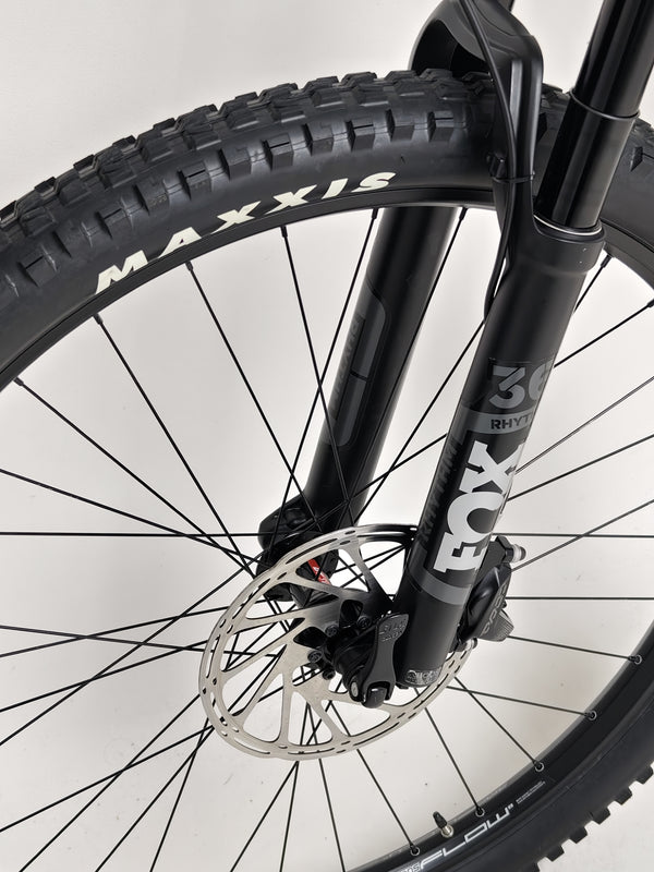 Norco Sight A2 2021 mountain bike parked under a tree, highlighting outdoor durability.