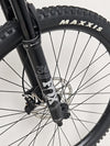 Performance view of the Norco Sight A2 2021 mountain bike in action on a technical trail.