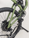 Ambitious view of the Norco Sight A2 2021 mountain bike against a forest backdrop, ready for trails.