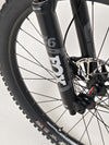 The Norco Sight A2 2021 shown on a rocky trail, emphasizing its enduro characteristics.