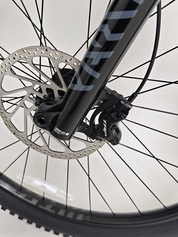 Close-up of the suspension setup on the GT Force Carbon Elite 2023, designed for mountain biking performance.