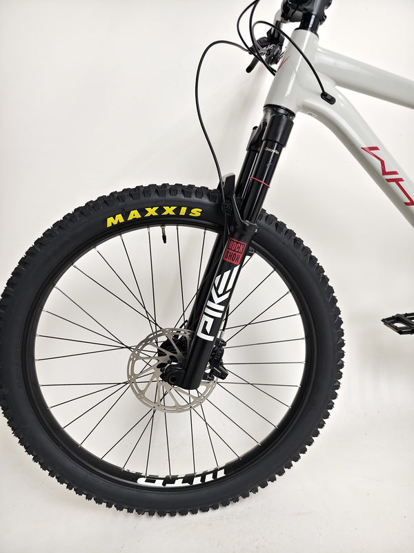 Thrilling action shot of the Whyte 905 V5 2023 Mountain Bike conquering rough terrains.