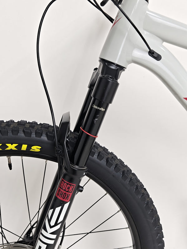 Over-the-shoulder shot of the rider on a Whyte 905 V5 2023 Mountain Bike displaying its handling.