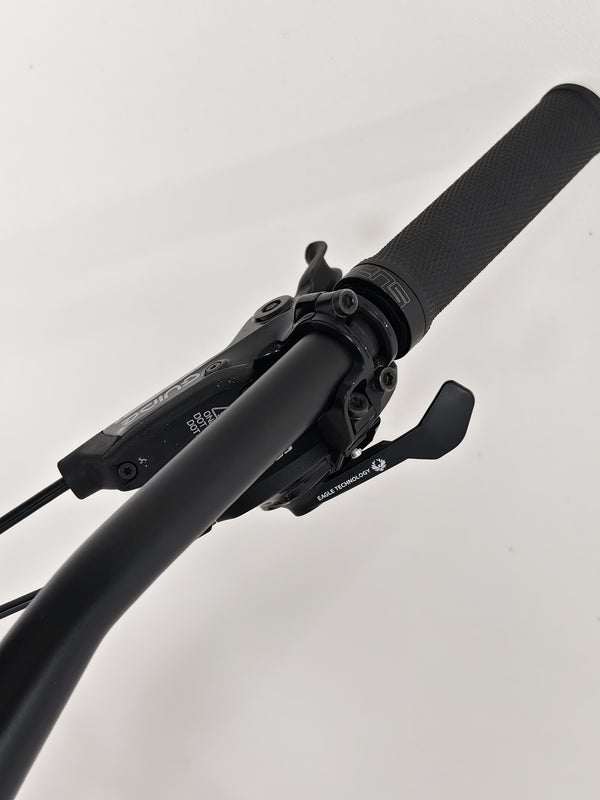 Close-up of the gearing system on the Whyte 905 V5 2023 Mountain Bike, showcasing its technical features.