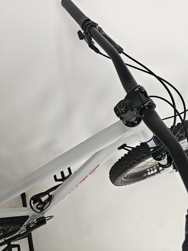 On-the-road shot of the Whyte 905 V5 2023 Mountain Bike representing speed and agility.
