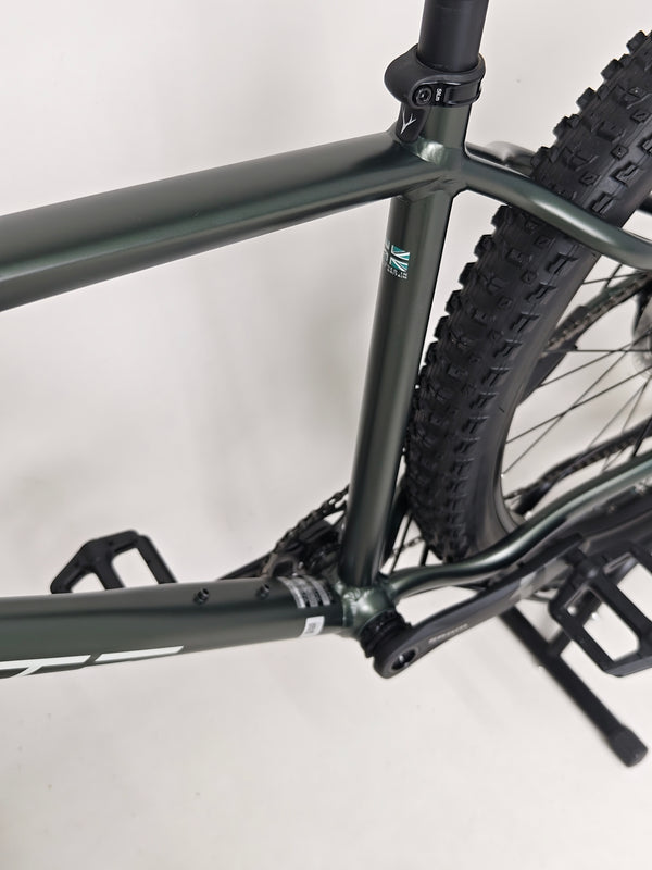 Close-up of the handlebars of the Whyte 901 V4 2022 Mountain Bike featuring controls and grips.