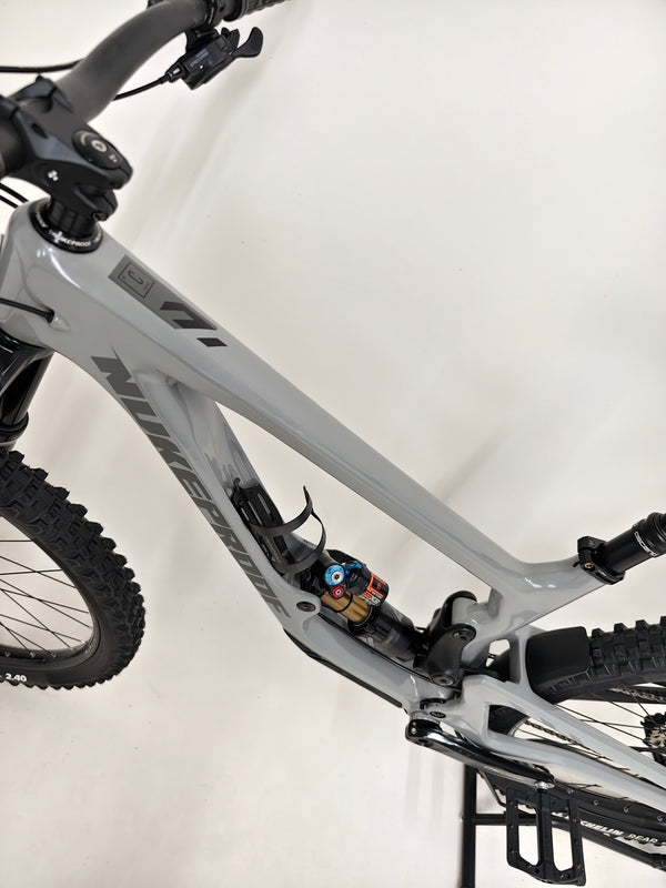 Nukeproof Giga 290 Comp Carbon 2022 bike parked with view of the scenery.