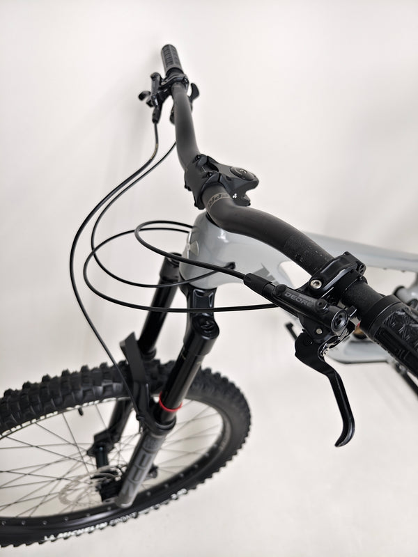Close-up view of tires and wheels on the Nukeproof Giga 290 Comp Carbon 2022.