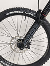 Nukeproof Giga 290 Comp Carbon 2022 mountain bike captured during a thrilling ride.