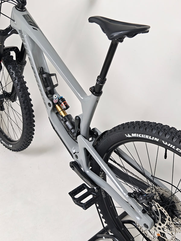 Nukeproof Giga 290 Comp Carbon 2022 mountain bike parked in a scenic outdoor area.