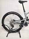 Nukeproof Giga 290 Comp Carbon 2022 bike displayed on rugged terrain.