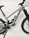 Action shot of the Nukeproof Giga 290 Comp Carbon 2022 bike on a dirt track.