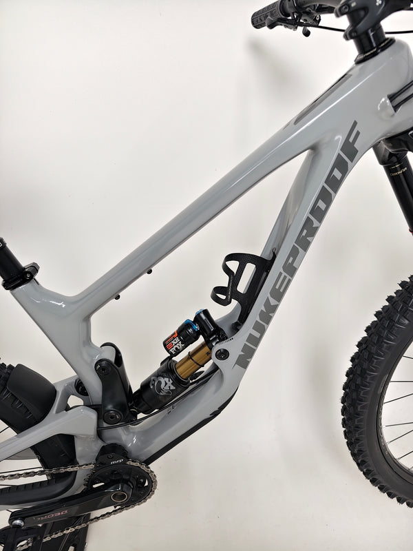 Nukeproof Giga 290 Comp Carbon 2022 showcasing its adjustable pivot and frame design.