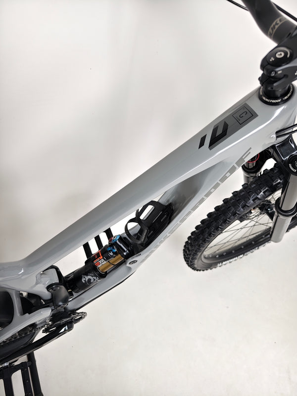 Front view of Nukeproof Giga 290 Comp Carbon 2022 displaying brand details.