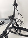 Nukeproof Giga 290 Comp Carbon 2022 bike on a rocky trail illustrating its capability.