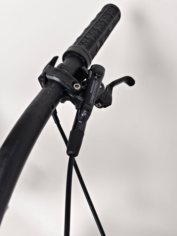 Nukeproof Giga 290 Comp Carbon 2022 bike positioned against a scenic outdoor backdrop.