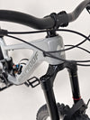 Nukeproof Giga 290 Comp Carbon 2022 bike positioned in an urban setting.