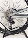 Artistic shot of the Nukeproof Giga 290 Comp Carbon 2022 bike framed by nature.
