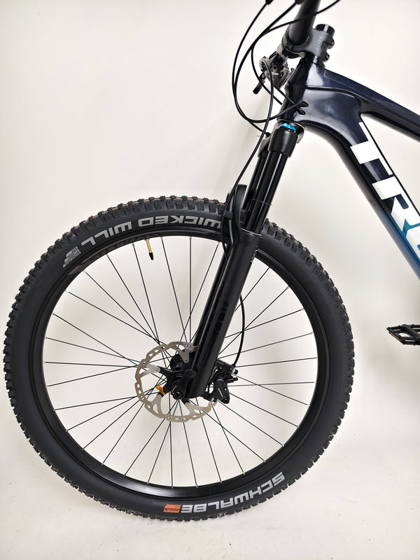 Image showcasing the intricate engineering behind the Trek Top Fuel 9.7 2022 CARBON mountain bike.