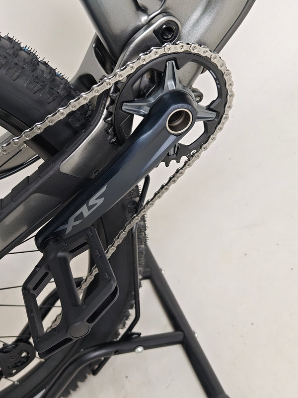 Dynamic action shot featuring the Trek Top Fuel 9.7 2022 CARBON mountain bike on a trail.