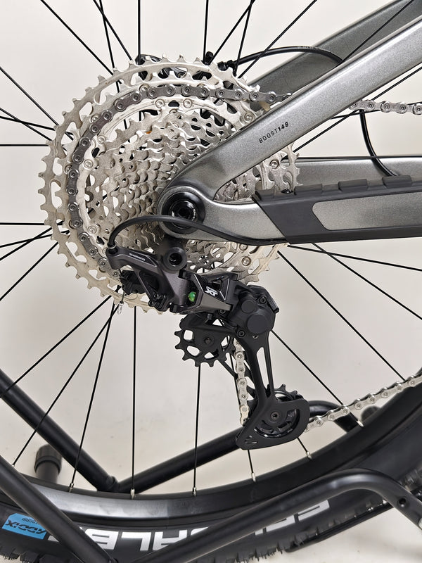 Trek Top Fuel 9.7 2022 CARBON bike parked against a scenic background.