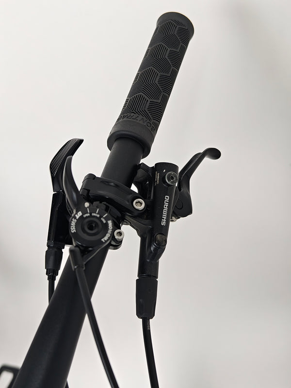 High angle view of Trek Top Fuel 9.7 2022 CARBON bike under natural sunlight, emphasizing color.