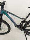 View of the front tire on the Scott Spark RC 900 Team Issue AXS Carbon in a natural setting.