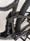 Action shot of the Scott Spark RC 900 Team Issue AXS Carbon bike in motion on a trail.