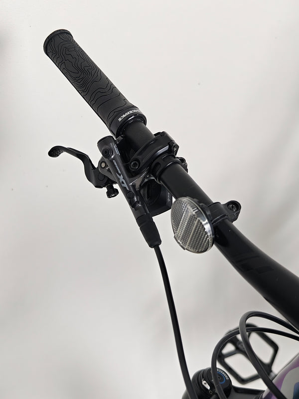 Scott Spark RC 900 Team Issue AXS Carbon bike in action, showing its performance capability.