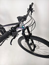Beautiful perspective of Scott Spark RC 900 Team Issue AXS Carbon bike on a rocky terrain.
