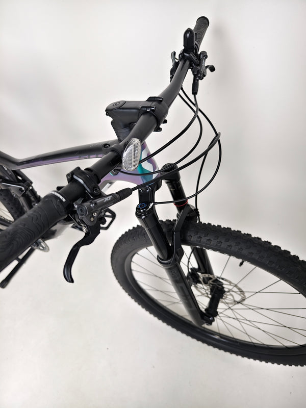 Beautiful perspective of Scott Spark RC 900 Team Issue AXS Carbon bike on a rocky terrain.