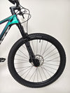 Scott Spark RC 900 Team Issue AXS Carbon bike positioned elegantly in a natural setting.