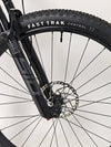 Aerial view of Scott Spark RC 900 Team Issue AXS Carbon bike in a vibrant landscape.