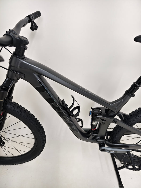 Trek Top Fuel 8 GX AXS 2024 bike laid out to show off its components and precision craftsmanship.