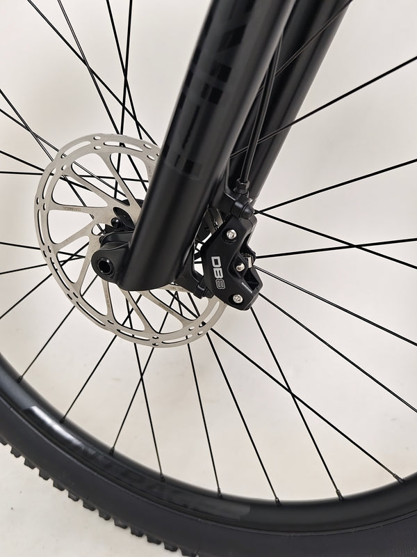 Trek Top Fuel 8 GX AXS 2024 bike profile illustrating the 120 mm travel suspension in action.